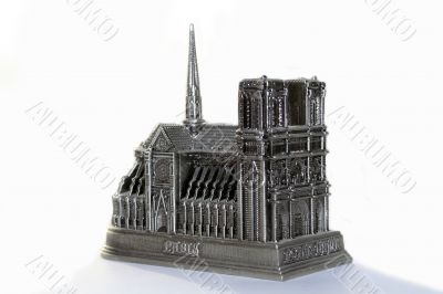 metal souvenir of notre dame de paris on white background