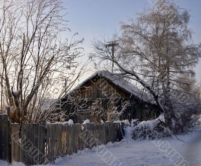 snow-capped log cabin