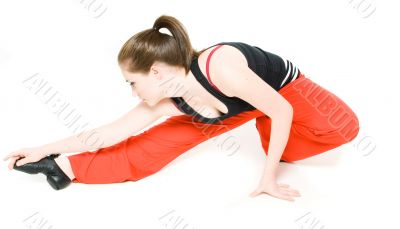A young girl stretching