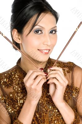 Beautiful asian girl playing with chopsticks