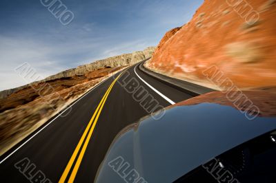 car driving on road with motion blur