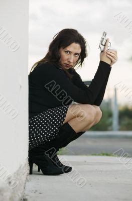 Hispanic Woman with Handgun