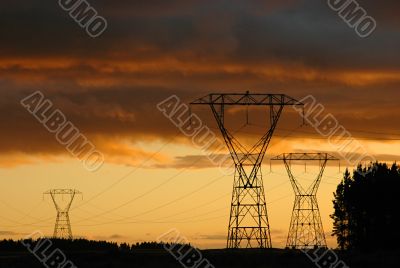Electric towers and dramatic sunset.