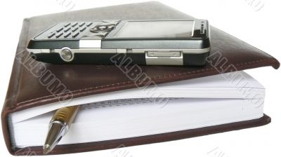 Mobile telephone, note pad and pen