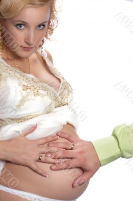 touching abdomen of beautiful pregnant woman