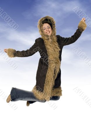 teenager jumping of joy in winter