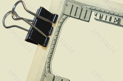 black paper clip and the US dollars