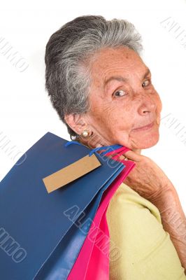 beautiful elderly woman with shopping bags