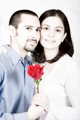 casual couple in love - red flower