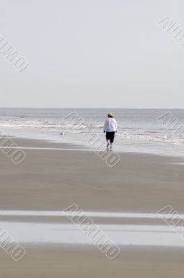 Woman Walking on Beach-Vertical