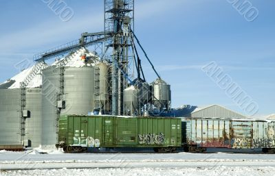 Grain Storage and Rail Cars with Graffiti