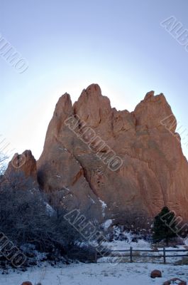 Sunrise Glow Behind Red Rock Formation