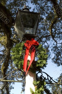 Decorative Lamp Detail with Christmas Wreath and Red Bow