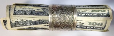 hundreds of US dollars in silxer napkin ring