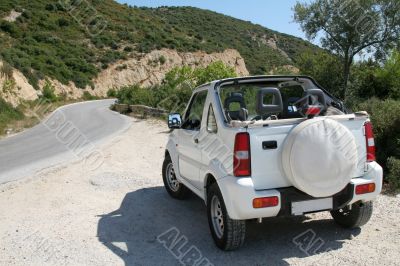 Little white jeep on an island