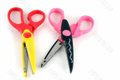 Brightly colors craft scissors on a white background