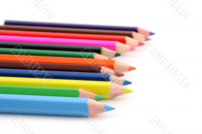 Colored pencils on a white background with a shallow DOF