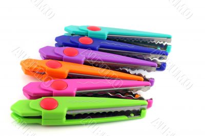 Brightly colors craft scissors on a white background