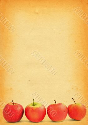 apples against old stained paper