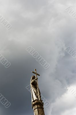Saint holding a cross