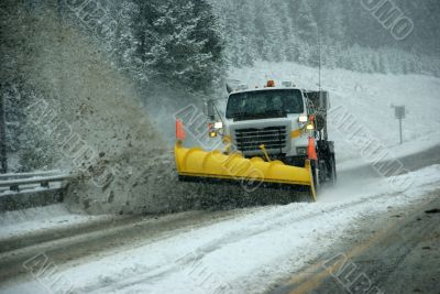 Snowplow clearing road