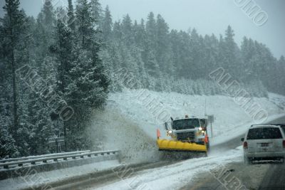 Snowplow clearing road