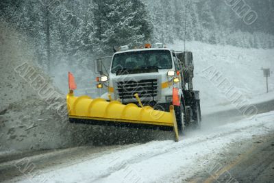 Snowplow clearing road