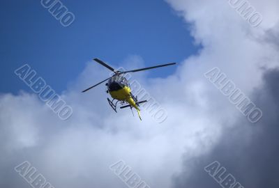 Helicopter in the sky. Bottom view.