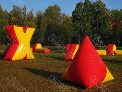 paintball battlefield, inflatable figures on field
