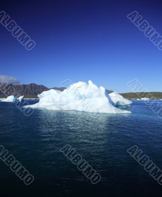 Iceberg against a blue sky