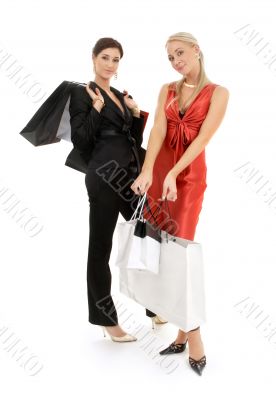 two happy girls with shopping bags