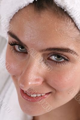 Wet faced girl in towel