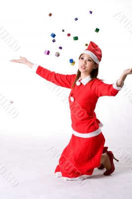 girl kneeling with falling christmas gifts