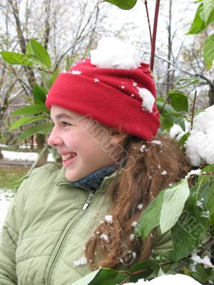 The girl in  near snow bush