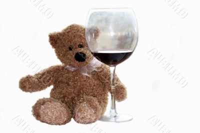 teddy bear with glass of wine isolaited on white background