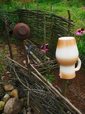 village life - braided fence and pitcher