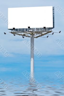 Blank billboard on cloudy sky