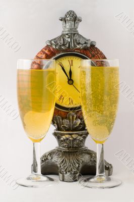 Clock and two tall wine glass