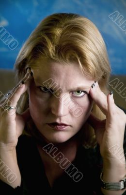 Blonde Woman Touching Forehead