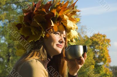 The happy girl on picnic behind city