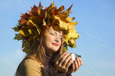 The happy girl on picnic behind city