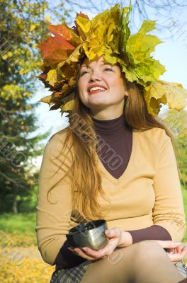 The happy girl on picnic behind city