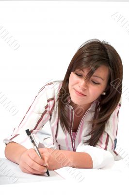 beautiful teenager studying on the floor