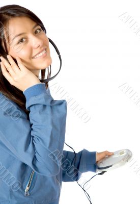 girl listening to music on a cd player