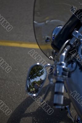 motorcycle with people in mirror