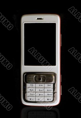 White cellular phone on black background