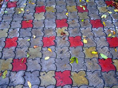 Sidewalk With Coloured Autumn Leafs