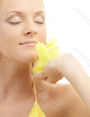 portrait of girl with yellow feathers