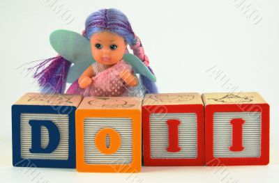 Doll and bricks