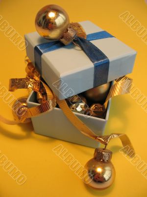 Blue gift box with golden balls